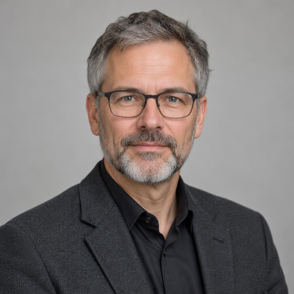 Portrait of a man with short hair and beard