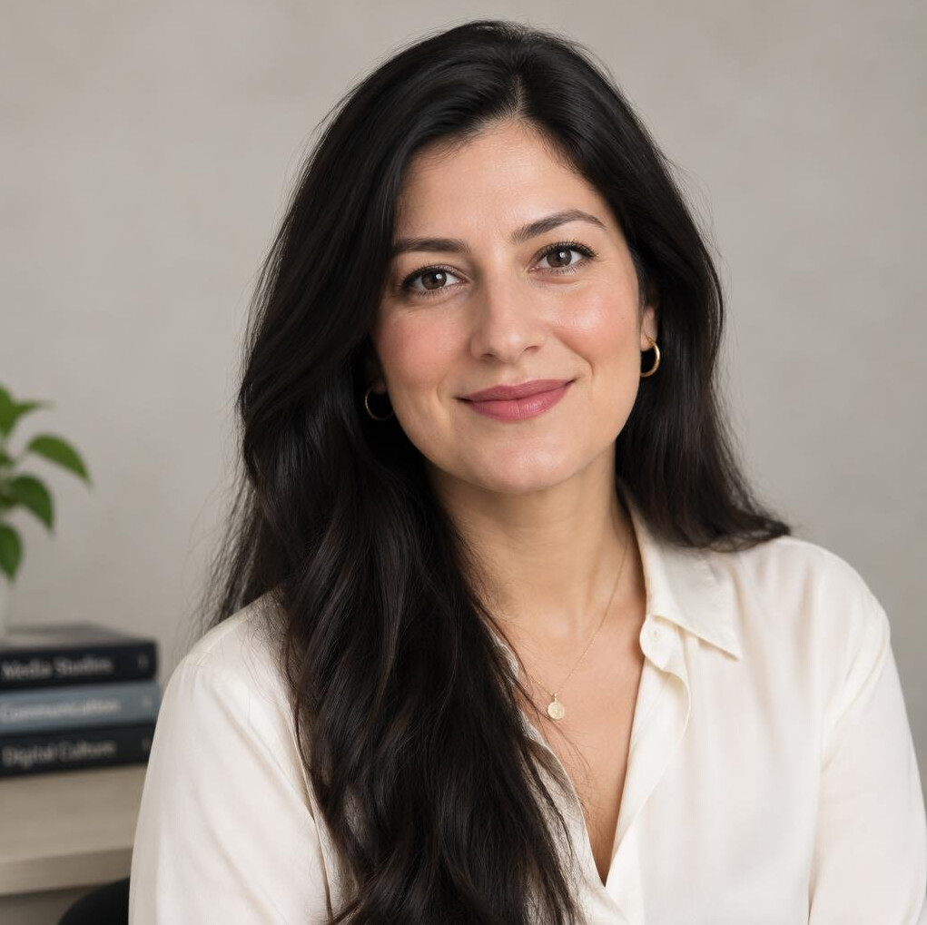 Portrait of a woman with long hair looking at the camera